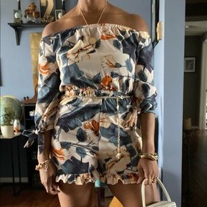 Fashion Nova floral romper with tie sleeves.